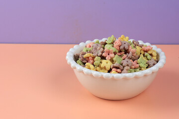 Colorful Honey Stars Floser Breakfast Cereal in White Bowl.