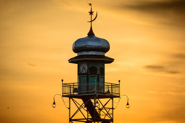 Mosque Demak Minaret Silhouette with Orange Sunset Sky © adi