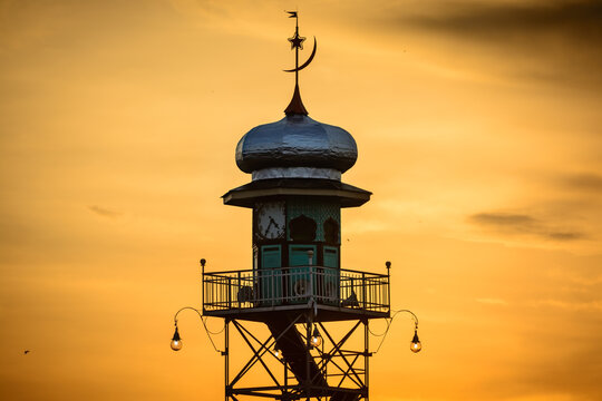 Mosque Demak Minaret Silhouette with Orange Sunset Sky