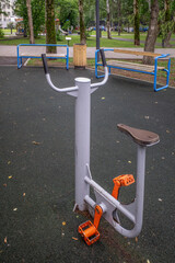 Bicycle simulator at the sports ground on an autumn day