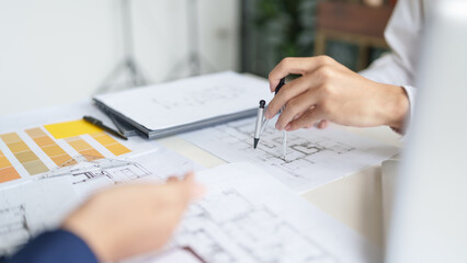 Architecture drawing on architectural project business architecture building construction Colleagues designer Planning Design on blueprint and compasses