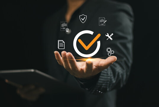businessman working with guarantee check mark for business automation process, Service guarantee, clients service, quality assurance management, certification, online shopping, financial ecosystem.