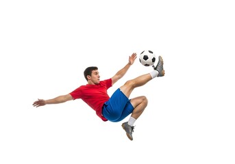 Dynamic Soccer Player Kicking Ball in Mid-Air Against a White Background