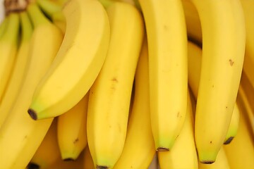 Fresh ripe bananas in a bunch on the market display