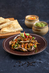 Kibdah Mugalgal, Minced goat's liver cooked with typical Middle Eastern spices and eaten with Khobus bread