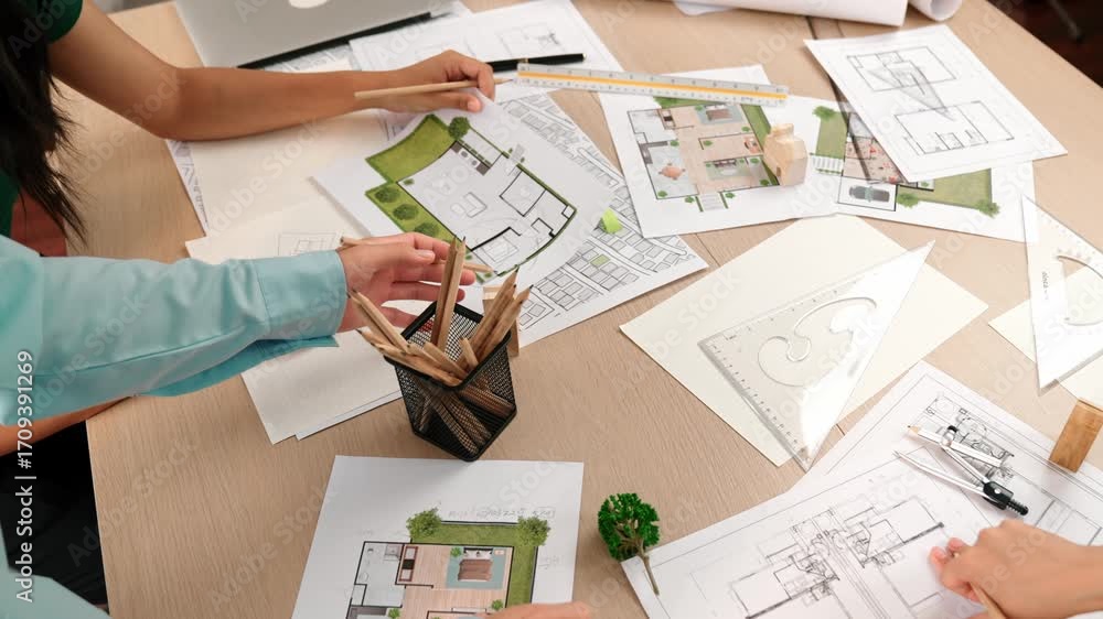Poster a video of architect team discuss with engineer hand writing a detail on blueprint during meeting to