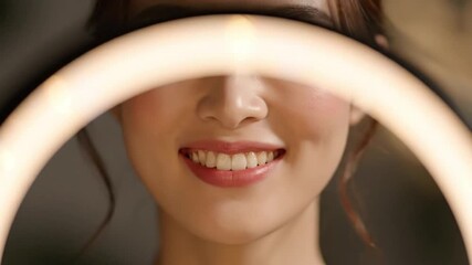 Asian woman adjusting ring light for perfect video conferencing and social media presence - Powered by Adobe