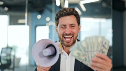 Excited businessman in a suit and white shirt triumphantly announces financial success. Confident male holds megaphone and cash in a modern office, celebrating profit and wealth. - Powered by Adobe
