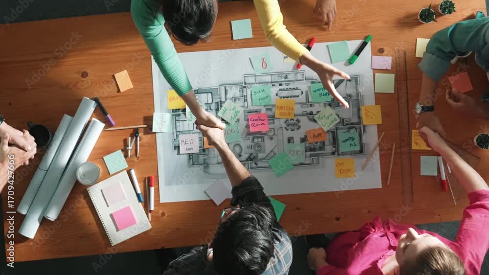 Poster top down view of smart business people shaking hands and making a contract. aerial view of architect