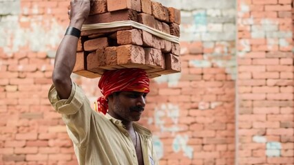 Construction worker carrying bricks on head, Indian labor man hard work, daily wage worker strength effort, building site masonry job, poverty struggle livelihood, manual labor endurance rural workfor