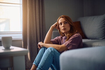Obraz premium Thoughtful woman thinking of her problems at home.