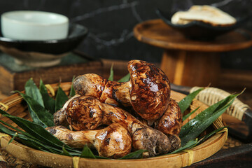 Fresh Matsutake Mushrooms from Yunnan China in Bamboo Basket with Pine Needles