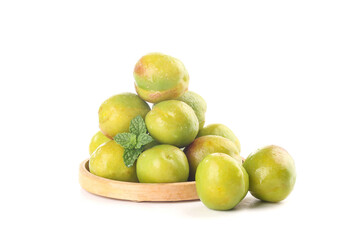 Fresh Green Xinjiang Apricots in Wooden Bowl with Mint Leaf on White Background