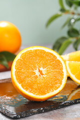 Fresh Orange Slices on Slate Board with Natural Citrus Fruit Background