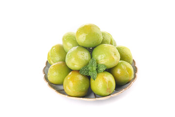 Fresh Green Plums in Wooden Bowl with Mint on White Background