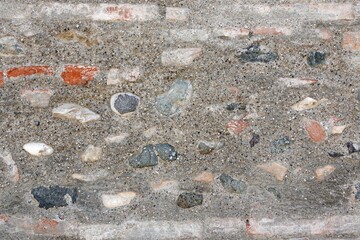 old brick wall, small and large bricks, pink shade