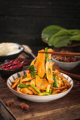 Fresh Bamboo Shoots Asparagus Stir-Fry Asian Cuisine Bathed in Sunshine on Rustic Wood Table