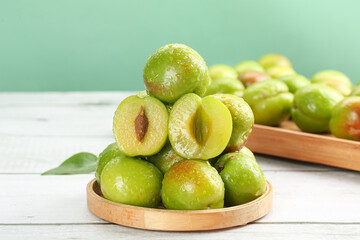 Fresh Xinjiang Green-Skinned Apricots and Pears in Wooden Bowls - Big Juicy Fruits Display