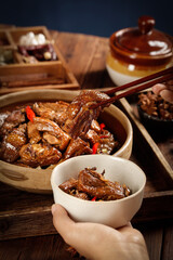 Braised Goose Meat in Traditional Wooden Bowls with Chopsticks - Asian Cuisine