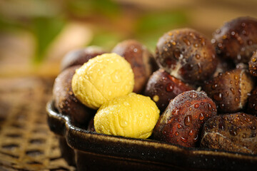 Fresh Roasted Alpine Chestnuts with Water Droplets in Rustic Bowl