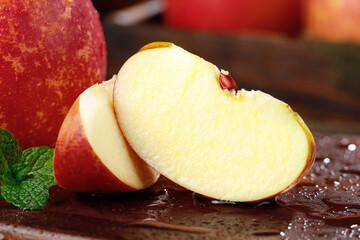 Fresh Sliced Red Apple with Water Droplets on Wooden Surface - Healthy Fruit Snack from Yanyuan Daliangshan Region