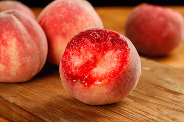 Fresh Ripe Peaches with Red Flesh on Wooden Board - Healthy Fruit Food Photography