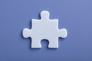 Obraz premium A Single White Puzzle Piece on a Solid Purple Background.