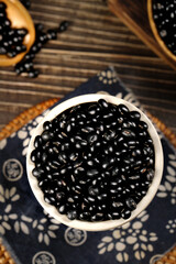 Mixed Black Beans in White Bowl on Wooden Background - Healthy Legume Food Ingredient