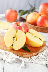 Fresh Red Fuji Apples Sliced on Wooden Board with Whole Apples in Basket - Healthy Organic Fruit from Xinjiang Aksu Region