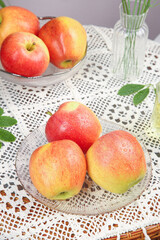 Fresh Red Gala Fuji Apples from Xinjiang in Glass Bowls on Lace Tablecloth