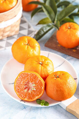 Fresh Yichang Seedless Oranges with Mint on White Plate - Healthy Citrus Fruit Display