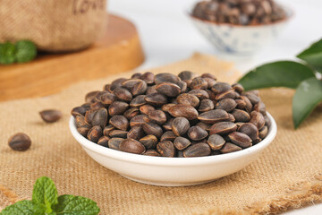 Pine Nuts in Bowl on Wooden Board - Wild Mountain Harvesting Natural Healthy Food Ingredient