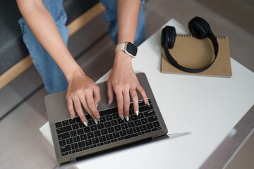 Remote Work. Close-up of woman typing on laptop.