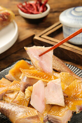 Hubei Salt-Baked Air-Dried Chicken Traditional Chinese Specialty Local Cuisine with Chopsticks and Tea