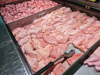 Fresh Raw Chicken Meat Display in Supermarket Refrigerated Case