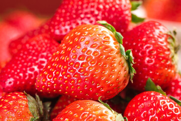 Fresh Organic Dandong Strawberries Close-up Detail on Blackstone Surface