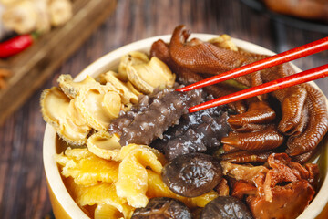 Asian Mushroom Noodle Soup with Red Chopsticks - Traditional Chinese Hot Pot Style Meal