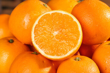 Fresh Orange Citrus Fruits Cut in Half Showing Juicy Interior