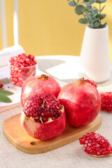 Fresh Pomegranate Seeds on Wooden Board - Healthy Organic Fruit Food Photography