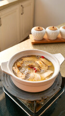 Fresh Gourmet Mushroom Soup with Agaricus Mushrooms in Ceramic Pot - Traditional Asian Cooking