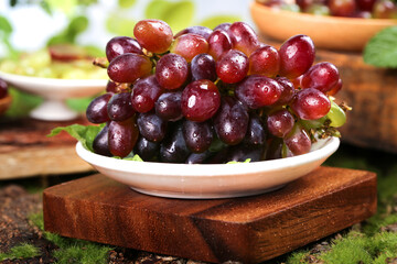 Fresh Red Grapes with Water Droplets in Bowl on Wooden Board - Healthy Organic Fruit Harvest