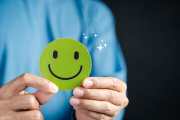 Customer satisfaction with green smiley face. positive review, happiness, service quality, feedback, trust, and successful business relationship.