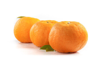 Fresh Ripe Tangerines with Green Leaves on White Background