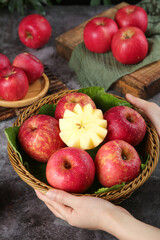 Fresh Red Fuji Apples from Yunnan China in Wicker Basket with Cut Apple Showing Star Pattern