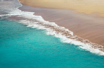 Exotic paradise with turquoise ocean waves and pristine golden sand. The perfect shoreline for a long, quiet walk. The rhythm of the sea, the feel of the sand.