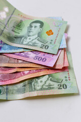 Banknotes with coins of the Thai baht money