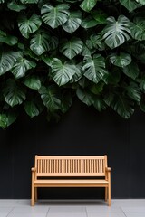 Minimalist wooden bench placed under lush tropical leaves against a dark wall. A stylish combination of nature and design, symbolizing relaxation, modern interiors, and eco-friendly lifestyle.