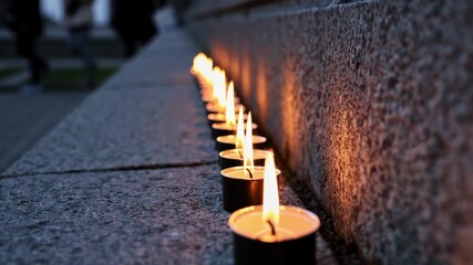 Flickering candlelight illuminates serenity along a tranquil stone pathway at dusk - Powered by Adobe