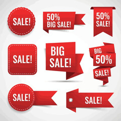 Collection of red sale tags and banners with different shapes and designs.