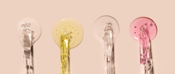 samples serum tests glass pipettes with drops of serum on a light beige background